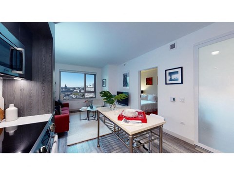 a living room with a table and a window